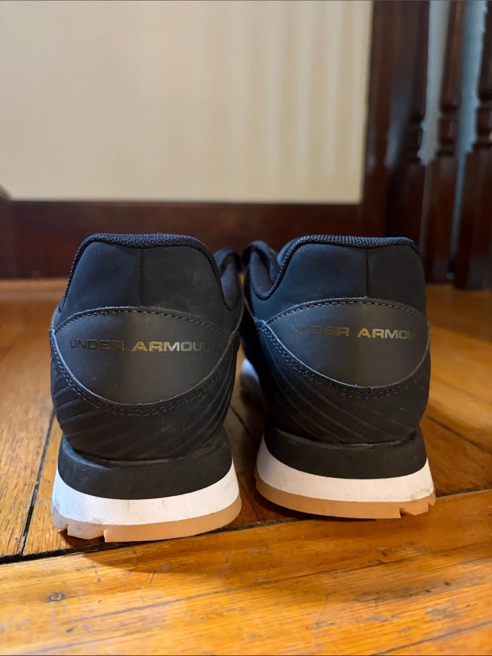 Under Armour Black Athletic Shoes with Gold Logo Accents